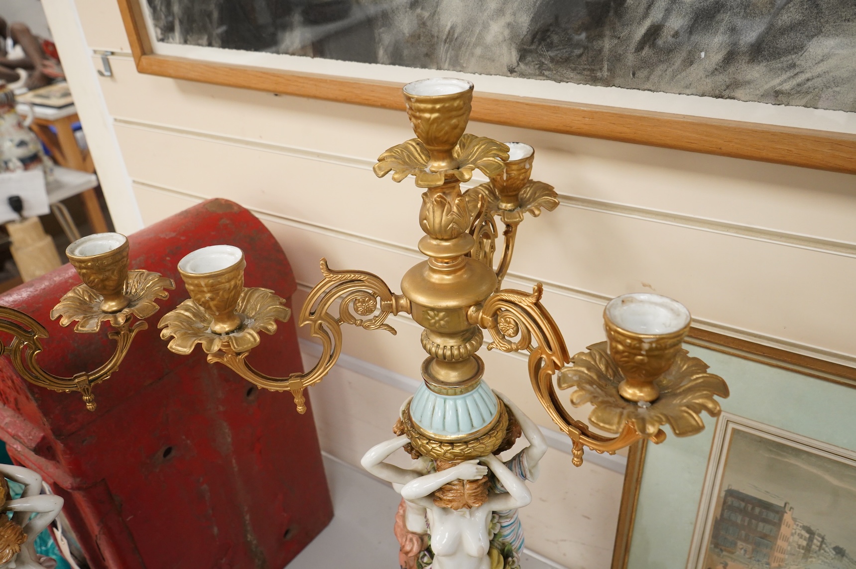 A pair of mid 20th century Italian porcelain and gilt metal mounted figural candelabra- 69cm high